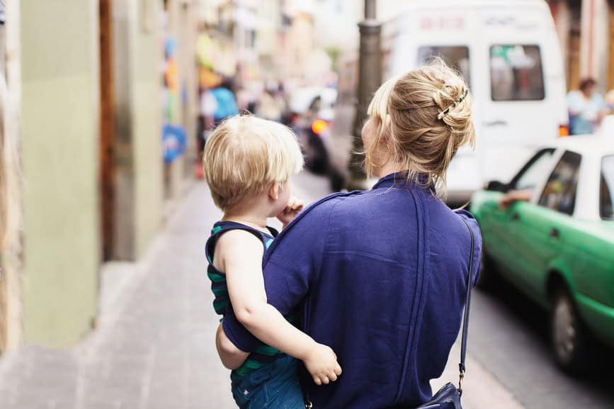 Rear view of woman holding toddler